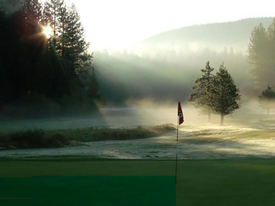 Early spring day at sunrise on the course