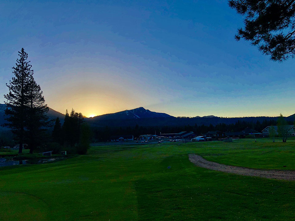 Sun rising over Mt. Tallac from the course